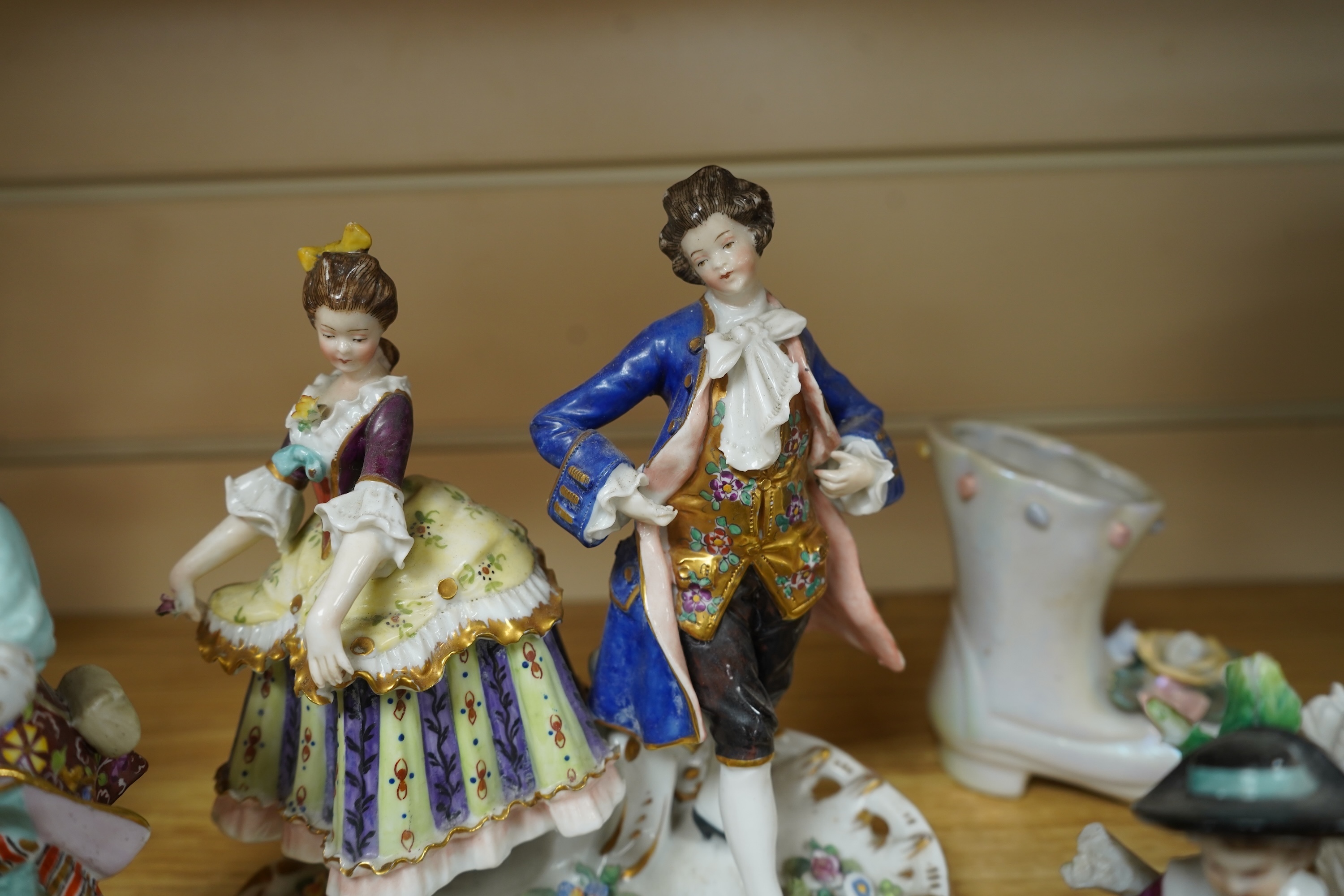 A French porcelain figure of a Mansion House dwarf, various German porcelain figures, an engraved glass and bowl. Glass 19cm